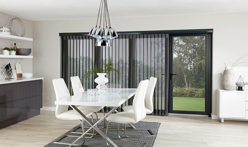 Allusion Blinds over dining room patio doors by Blind Technique