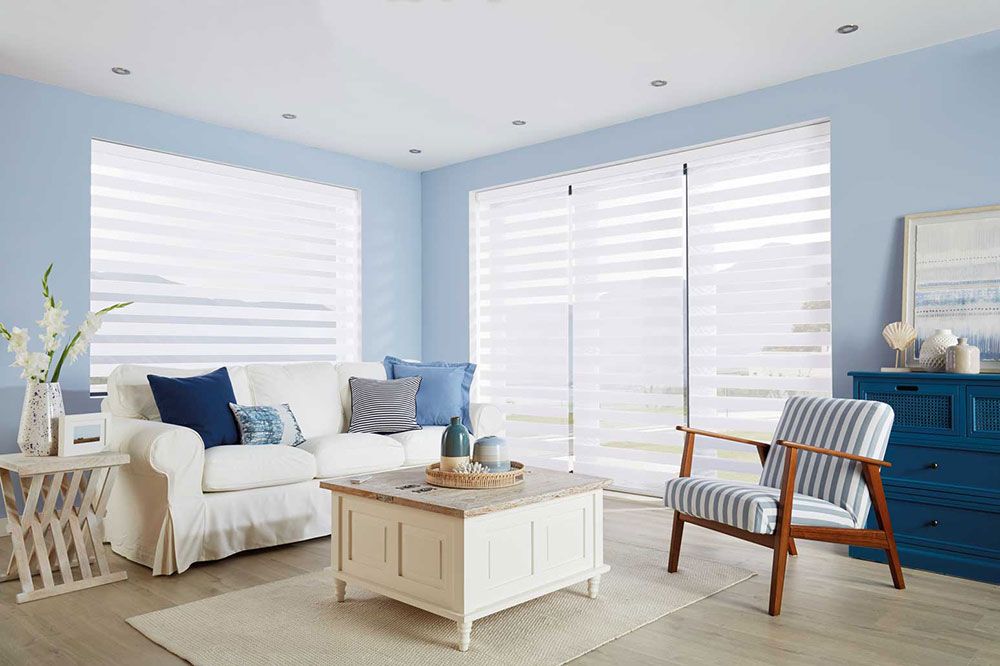 Duo-Vision blinds on floor to ceiling dual aspect windows in a lounge.