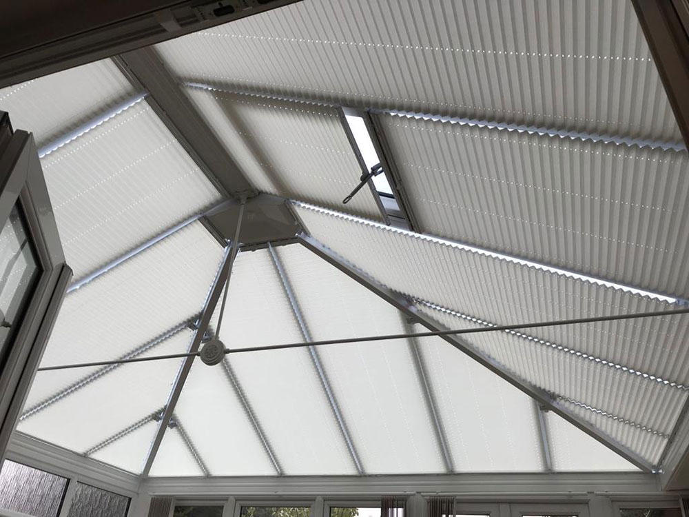 Pleated conservatory blinds shown in a conservatory roof