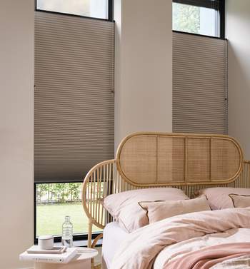Bedroom open up close down versatile pleated blind with a blackout fabric from Luxaflex